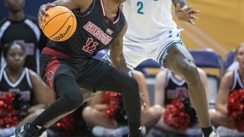 Terrance Ford Jr. (11) controls the ball during the Coastal Carolina vs. Arkansas State men   s basketball game in the first round of the Sun Belt Basketball Championship tournament at the Bay Center in Pensacola on Tuesday, Feb. 28, 2023.

Coastal Carolina Vs Arkansas State Men S Basketball