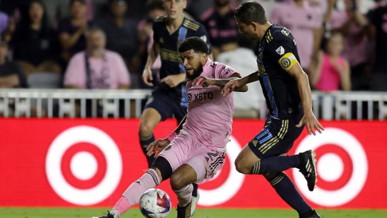 Mar 4, 2023; Fort Lauderdale, Florida, USA; Inter Miami CF defender DeAndre Yedlin (2) and Philadelphia Union midfielder Alejandro Bedoya (11) battle for the ball in the second half at DRV PNK Stadium. Mandatory Credit: Sam Navarro-USA TODAY Sports