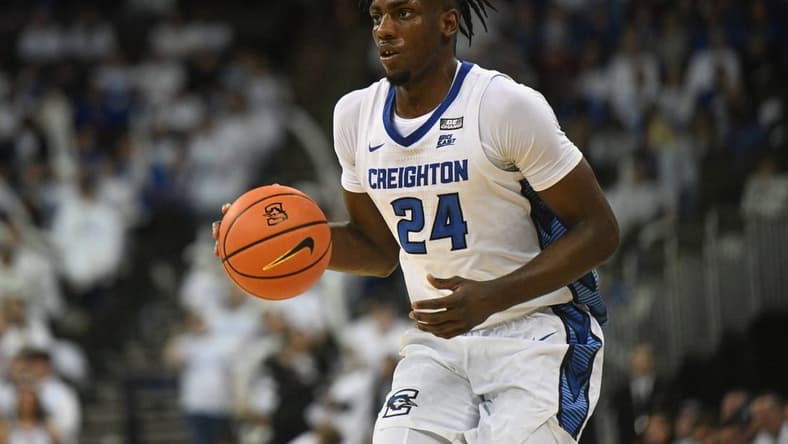 Mar 1, 2023; Omaha, Nebraska, USA;  Creighton Bluejays forward Arthur Kaluma (24) dribbles against the Georgetown Hoyas in the second half at CHI Health Center Omaha. Mandatory Credit: Steven Branscombe-USA TODAY Sports