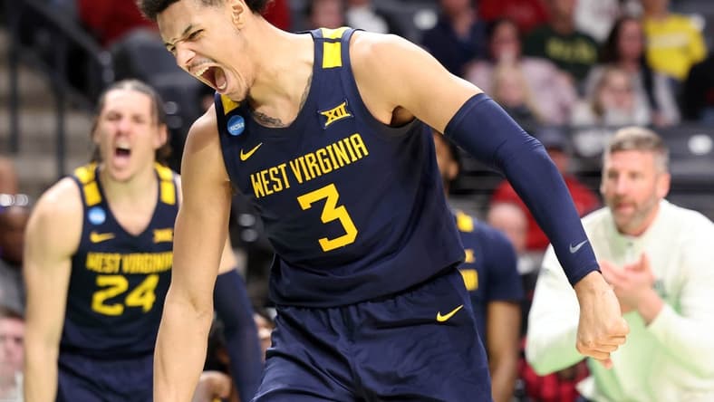 Mar 16, 2023; Birmingham, AL, USA; West Virginia Mountaineers forward Tre Mitchell (3) reacts after scoring a basket while being fouled against the Maryland Terrapins during the second half in the first round of the 2023 NCAA Tournament at Legacy Arena. Mandatory Credit: Vasha Hunt-USA TODAY Sports