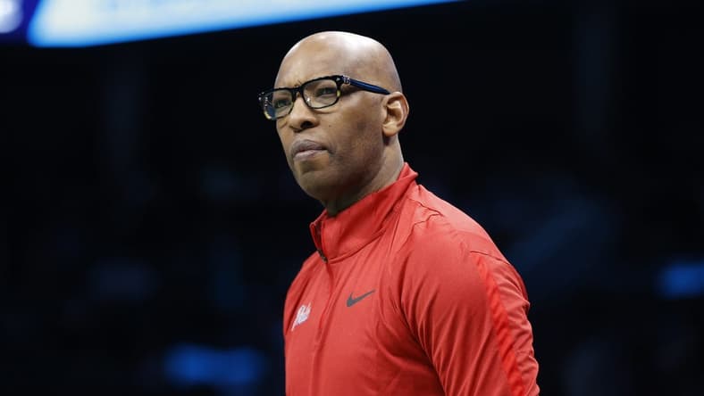 Mar 17, 2023; Charlotte, North Carolina, USA; Philadelphia 76ers assistant coach Sam Cassell looks on from the sideline during the first half against the Charlotte Hornets at Spectrum Center. Mandatory Credit: Brian Westerholt-USA TODAY Sports