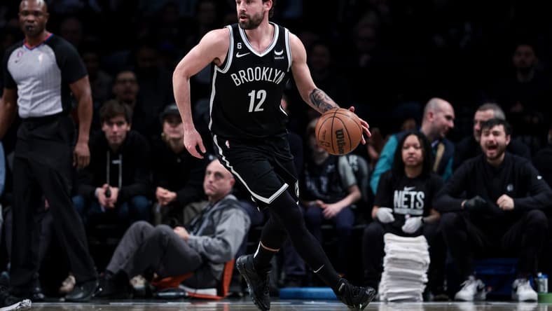 Mar 21, 2023; Brooklyn, New York, USA; Brooklyn Nets forward Joe Harris (12) dribbles during the first half against the Cleveland Cavaliers at Barclays Center. Mandatory Credit: Vincent Carchietta-USA TODAY Sports