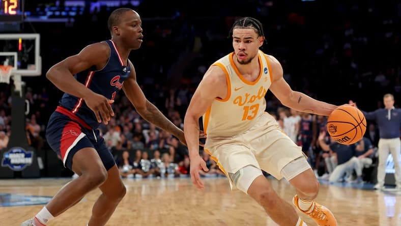 Mar 23, 2023; New York, NY, USA; Tennessee Volunteers forward Olivier Nkamhoua (13) drives to the basket against Florida Atlantic Owls guard Johnell Davis (1) during the second half at Madison Square Garden. Mandatory Credit: Brad Penner-USA TODAY Sports