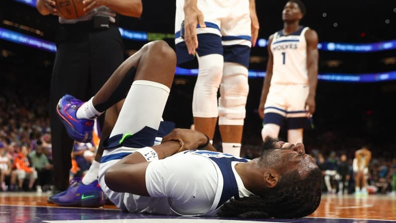 Mar 29, 2023; Phoenix, Arizona, USA; Minnesota Timberwolves center Naz Reid (11) reacts after suffering an injury against the Phoenix Suns in the second half at Footprint Center. Mandatory Credit: Mark J. Rebilas-USA TODAY Sports