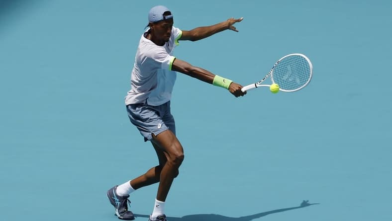 Mar 30, 2023; Miami, Florida, US; Christopher Eubanks (USA) hits a backhand against Daniil Medvedev (not pictured) in a men's singles quarterfinal in the Miami Open at Hard Rock Stadium. Mandatory Credit: Geoff Burke-USA TODAY Sports