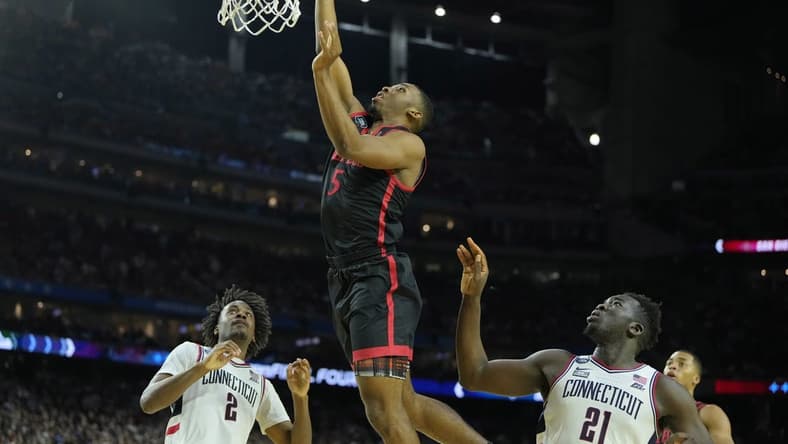 Apr 3, 2023; Houston, TX, USA; San Diego State Aztecs guard Lamont Butler (5) shoots the ball against the Connecticut Huskies during the second half in the national championship game of the 2023 NCAA Tournament at NRG Stadium. Mandatory Credit: Bob Donnan-USA TODAY Sports