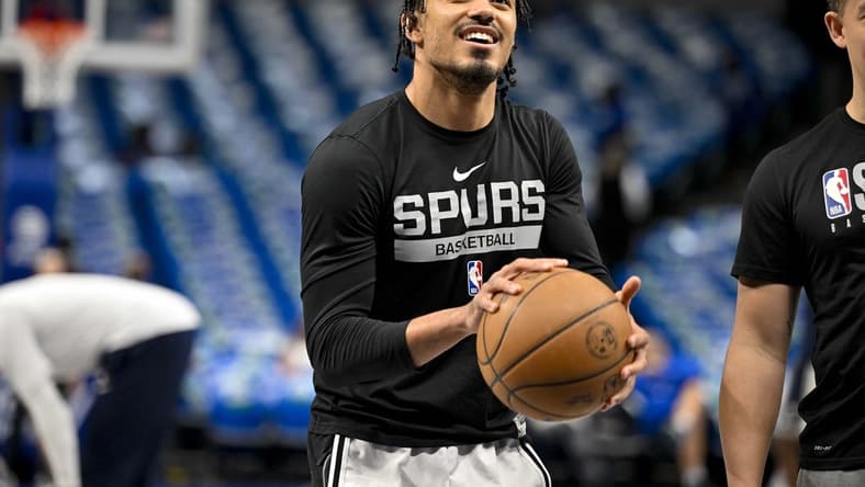 Apr 9, 2023; Dallas, Texas, USA; San Antonio Spurs guard Tre Jones (33) warms up before the game between the Dallas Mavericks and the San Antonio Spurs at the American Airlines Center. Mandatory Credit: Jerome Miron-USA TODAY Sports