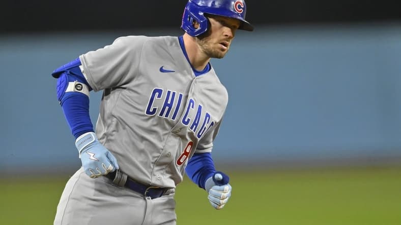 Apr 14, 2023; Los Angeles, California, USA;  Chicago Cubs left fielder Ian Happ (8) rounds the bases on a solo home run in the ninth inning against the Los Angeles Dodgers at Dodger Stadium. Mandatory Credit: Jayne Kamin-Oncea-USA TODAY Sports