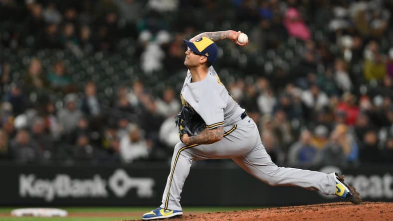 Apr 18, 2023; Seattle, Washington, USA; Milwaukee Brewers relief pitcher Matt Bush (21) pitches to the Seattle Mariners during the eighth inning at T-Mobile Park. Mandatory Credit: Steven Bisig-USA TODAY Sports