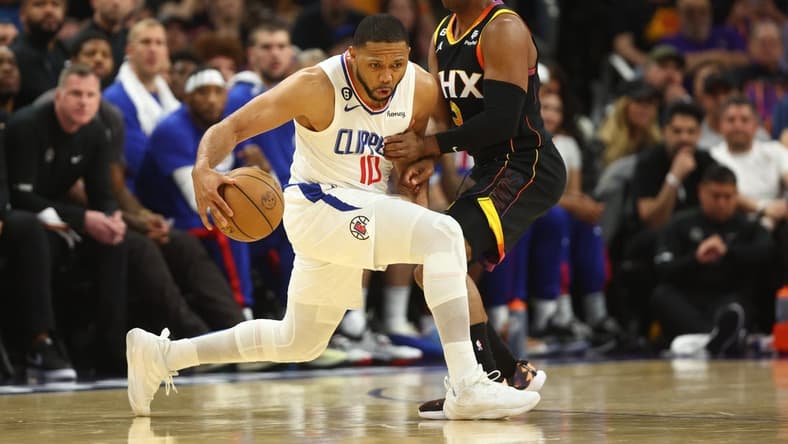 Apr 18, 2023; Phoenix, Arizona, USA; Los Angeles Clippers guard Eric Gordon (10) moves the ball against Phoenix Suns guard Chris Paul (3) in the second half during game two of the 2023 NBA playoffs at Footprint Center. Mandatory Credit: Mark J. Rebilas-USA TODAY Sports