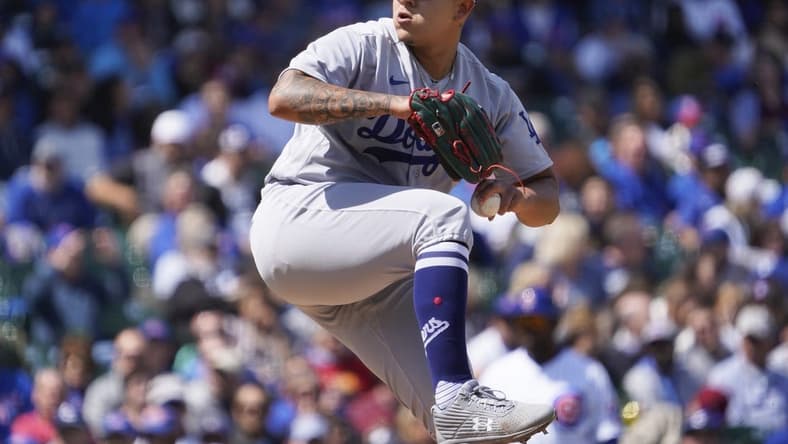 Apr 21, 2023; Chicago, Illinois, USA; Los Angeles Dodgers starting pitcher Julio Urias (7) throws the ball against the Chicago Cubs during the first inning at Wrigley Field. Mandatory Credit: David Banks-USA TODAY Sports