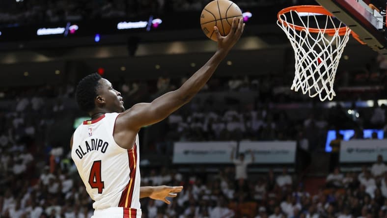 Apr 22, 2023; Miami, Florida, USA; Miami Heat guard Victor Oladipo (4) drives to the basket in the fourth quarter against the Milwaukee Bucks during game three of the 2023 NBA Playoffs at Kaseya Center. Mandatory Credit: Sam Navarro-USA TODAY Sports