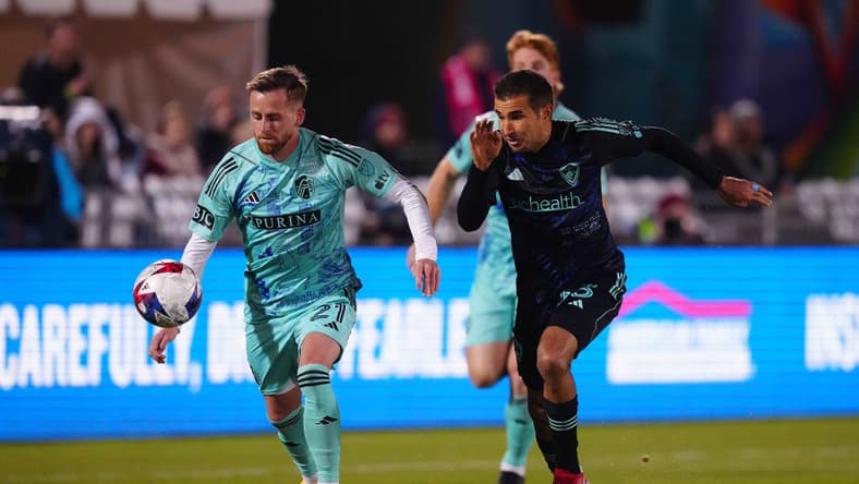 Apr 22, 2023; Commerce City, Colorado, USA; Colorado Rapids defender Steven Beitashour (33) battles for ball against St. Louis City forward Rasmus Alm (21) during first half at Dick's Sporting Goods Park. Mandatory Credit: Ron Chenoy-USA TODAY Sports