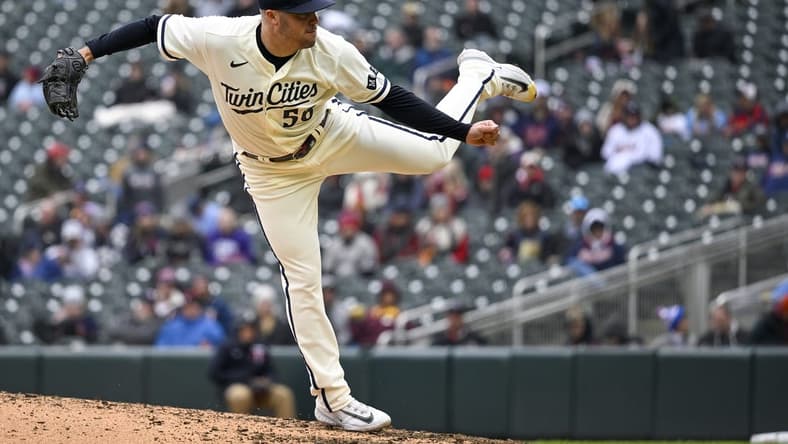 Apr 23, 2023; Minneapolis, Minnesota, USA; Minnesota Twins pitcher Caleb Thielbar (56) delivers against the Minnesota Twins at Target Field. Mandatory Credit: Nick Wosika-USA TODAY Sports
