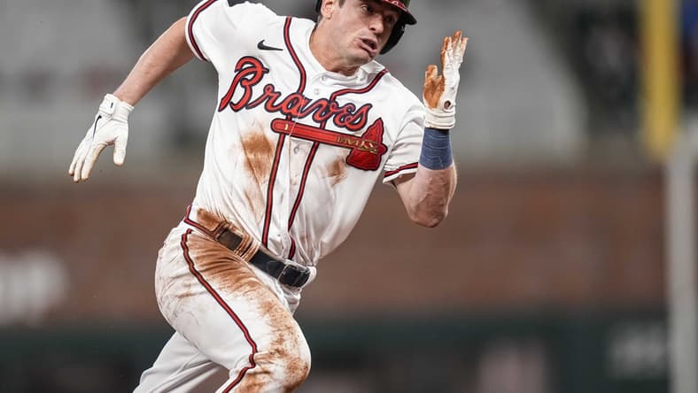 Apr 26, 2023; Cumberland, Georgia, USA; Atlanta Braves pinch runner Nick Solak (15) scores a run against the Miami Marlins during the eighth inning at Truist Park. Mandatory Credit: Dale Zanine-USA TODAY Sports