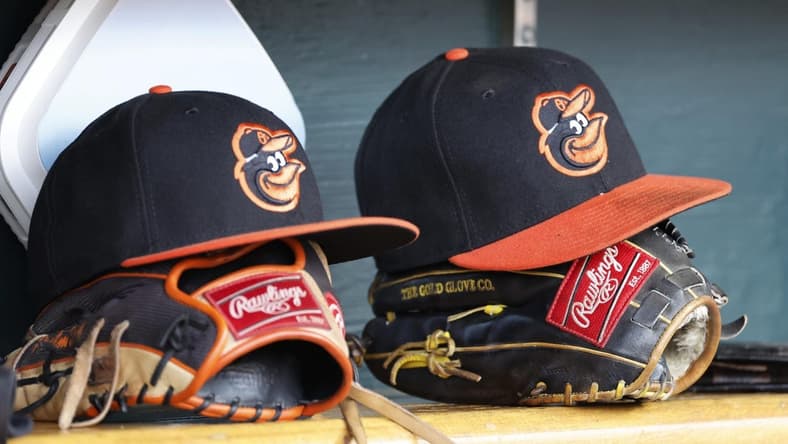 Apr 27, 2023; Detroit, Michigan, USA;  Baltimore Orioles hats and glove sits in dugout in the second inning against the Detroit Tigers at Comerica Park. Mandatory Credit: Rick Osentoski-USA TODAY Sports