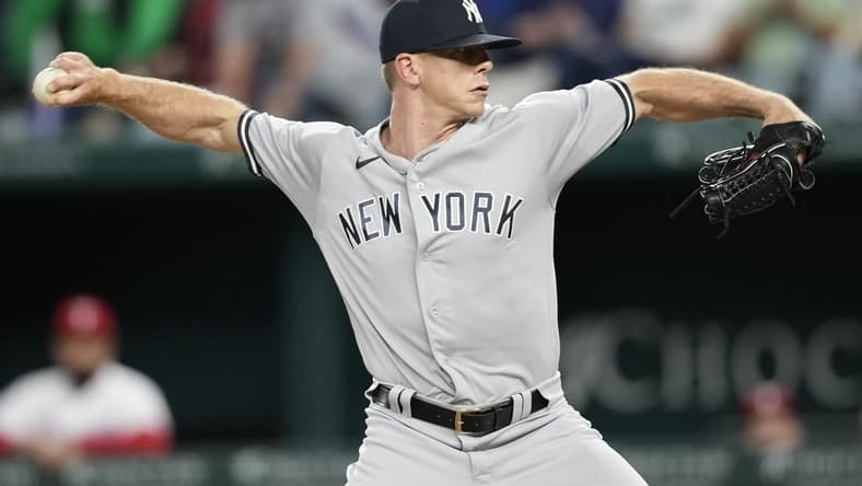Apr 29, 2023; Arlington, Texas, USA; New York Yankees relief pitcher Ian Hamilton (71) throws against the Texas Rangers during the seventh inning at Globe Life Field. Mandatory Credit: Jim Cowsert-USA TODAY Sports