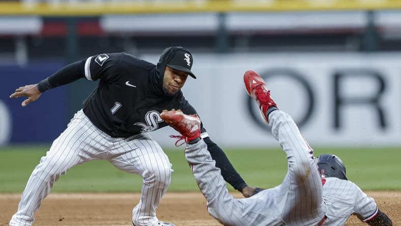 May 2, 2023; Chicago, Illinois, USA; Minnesota Twins left fielder Trevor Larnach (9) is caught stealing second base by Chicago White Sox shortstop Elvis Andrus (1) during the fourth inning at Guaranteed Rate Field. Mandatory Credit: Kamil Krzaczynski-USA TODAY Sports