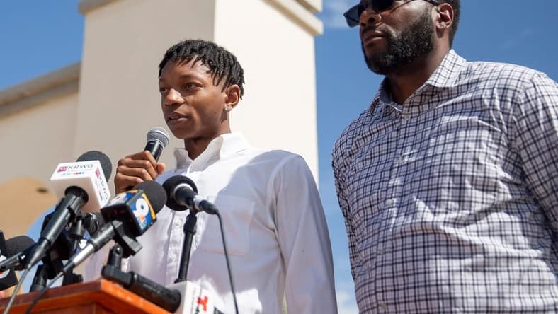 Deuce Benjamin, left, tears up while speaking in May about the alleged assault he faced while playing for NMSU. The two former NMSU players settled a suit against New Mexico State University, two former coaches and three former players.

Nmsu Lawsuit Presser