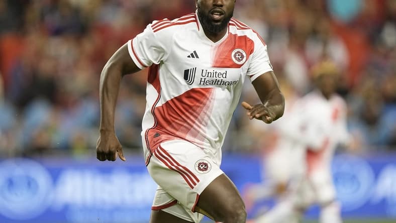 May 6, 2023; Toronto, Ontario, CAN; New England Revolution forward Jozy Altidore (14) runs downfield against Toronto FC during the second half at BMO Field. Mandatory Credit: John E. Sokolowski-USA TODAY Sports