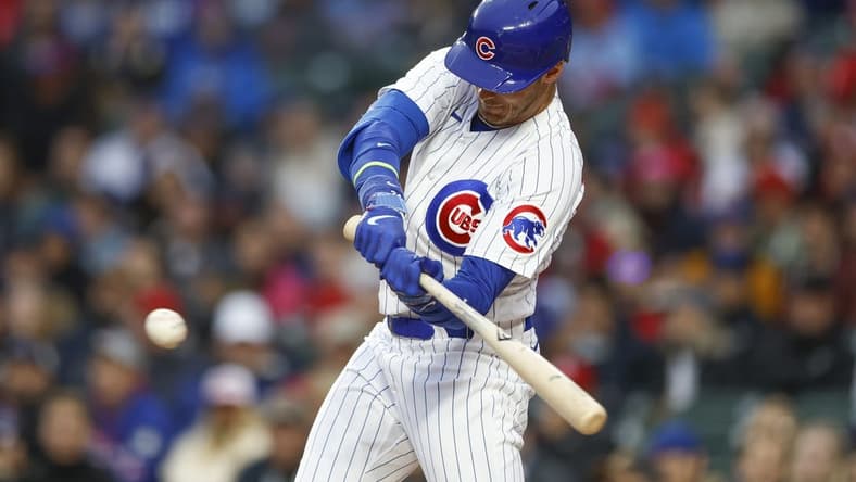 May 8, 2023; Chicago, Illinois, USA; Chicago Cubs center fielder Cody Bellinger (24) singles against the St. Louis Cardinals during the first inning at Wrigley Field. Mandatory Credit: Kamil Krzaczynski-USA TODAY Sports