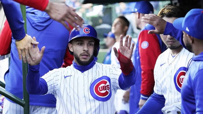 May 9, 2023; Chicago, Illinois, USA; Chicago Cubs infielder Nick Madrigal (1) is greeted in the dugout after scoring against the St. Louis Cardinals during the first inning at Wrigley Field. Mandatory Credit: David Banks-USA TODAY Sports