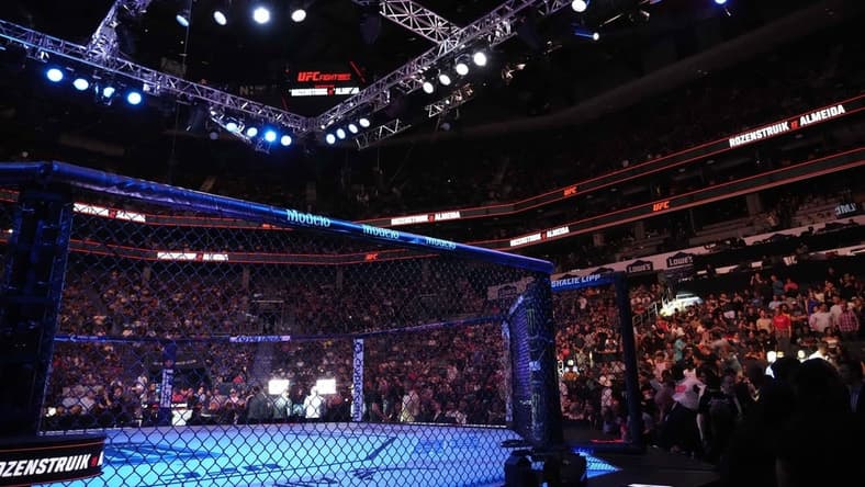 May 13, 2023; Charlotte, North Carolina, USA; The octagon is seen before a heavyweight bout between Jairzinho Rozenstruik (red gloves) and Jailton Almeida  (blue gloves) during UFC Fight Night at Spectrum Center. Mandatory Credit: Jim Dedmon-USA TODAY Sports