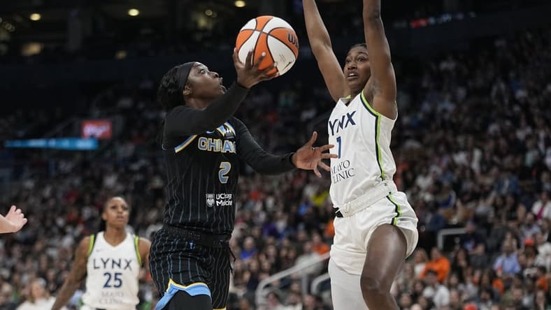 May 13, 2023; Toronto, Ontario, Canada; Chicago Sky guard Kahleah Copper (2) goes up to make a basket as Minnesota Lynx forward Diamond Miller (1) defends during the first half at Scotiabank Arena. Mandatory Credit: John E. Sokolowski-USA TODAY Sports