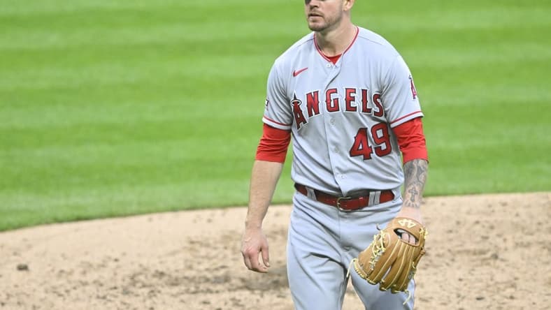 May 13, 2023; Cleveland, Ohio, USA; Los Angeles Angels relief pitcher Chris Devenski (49) walks off the field in the sixth inning against the Cleveland Guardians at Progressive Field. Mandatory Credit: David Richard-USA TODAY Sports