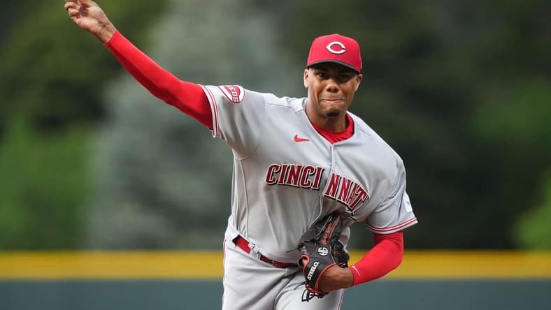 May 15, 2023; Denver, Colorado, USA; Cincinnati Reds starting pitcher Hunter Greene (21) delivers a pitch in the first inning against the Colorado Rockies at Coors Field. Mandatory Credit: Ron Chenoy-USA TODAY Sports