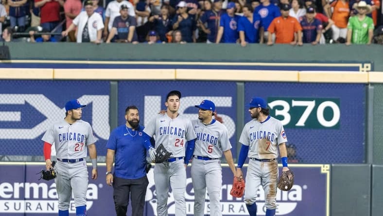 May 15, 2023; Houston, Texas, USA; Chicago Cubs center fielder Cody Bellinger (24) comes out of the game after making a catch against the wall against the Houston Astros in the seventh inning at Minute Maid Park. Mandatory Credit: Thomas Shea-USA TODAY Sports