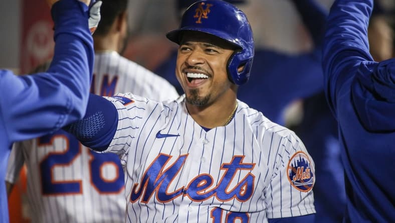 May 16, 2023; New York City, New York, USA; New York Mets third baseman Eduardo Escobar (10) is greeted in the dugout after hitting a pinch hit two run home run in the ninth inning against the Tampa Bay Rays at Citi Field. Mandatory Credit: Wendell Cruz-USA TODAY Sports