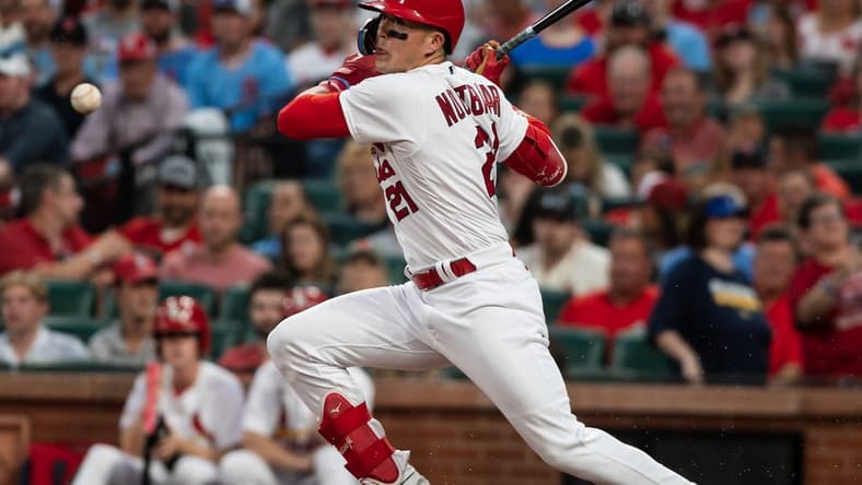 May 17, 2023; St. Louis, Missouri, USA; St. Louis Cardinals center fielder Lars Nootbaar (21) makes contact with the ball in the fourth inning at Busch Stadium. Mandatory Credit: Paul Halfacre-USA TODAY Sports