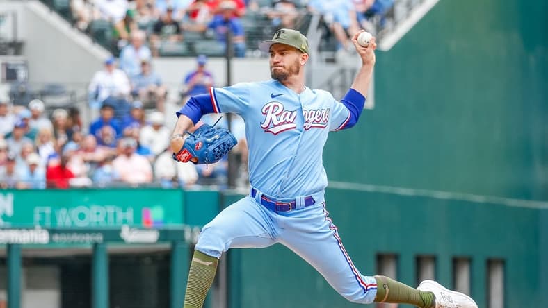 May 21, 2023; Arlington, Texas, USA; Texas Rangers starting pitcher Andrew Heaney (44) throws during the fourth inning against the Colorado Rockies at Globe Life Field. Mandatory Credit: Andrew Dieb-USA TODAY Sports
