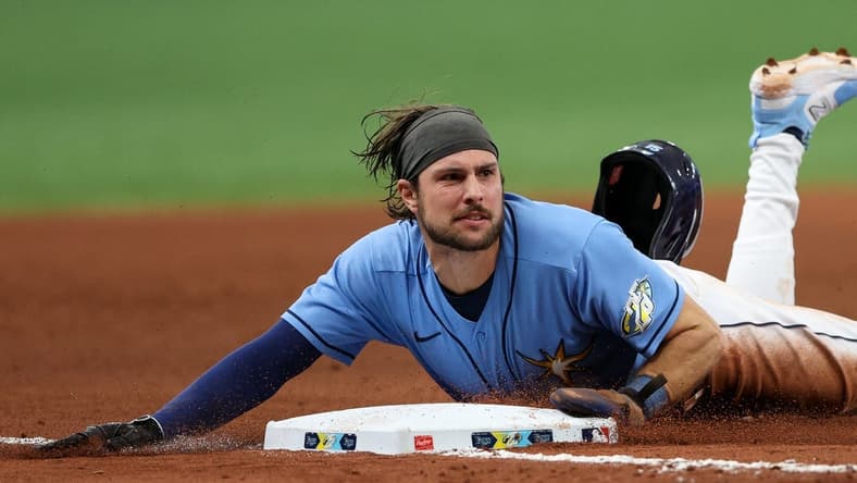 May 21, 2023; St. Petersburg, Florida, USA; Tampa Bay Rays second baseman Brandon Lowe (8) steals third base against the Milwaukee Brewers in the eight inning at Tropicana Field. Mandatory Credit: Nathan Ray Seebeck-USA TODAY Sports
