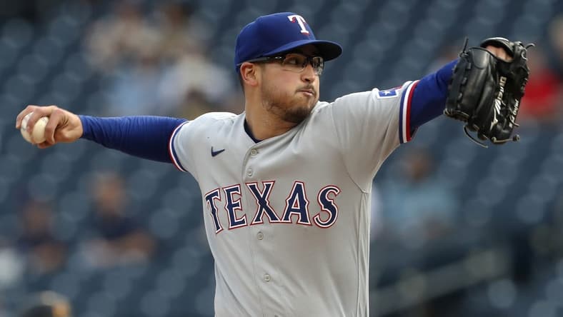 May 22, 2023; Pittsburgh, Pennsylvania, USA; Texas Rangers starting pitcher Dane Dunning (33) delivers a pitch against the Pittsburgh Pirates during the first inning at PNC Park. Mandatory Credit: Charles LeClaire-USA TODAY Sports