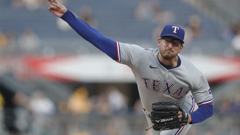 May 22, 2023; Pittsburgh, Pennsylvania, USA; Texas Rangers starting pitcher Dane Dunning (33) pitches against the Pittsburgh Pirates during the fifth inning at PNC Park. Mandatory Credit: Charles LeClaire-USA TODAY Sports