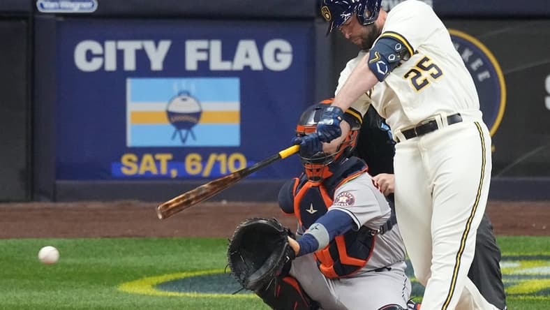 Milwaukee Brewers designated hitter Darin Ruf (25) hits a single during the eighth inning of the game against the Houston Astros Monday, May 22, 2023 at American Family Field in Milwaukee, Wis.