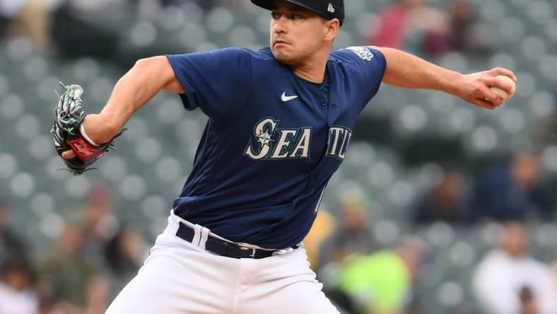May 23, 2023; Seattle, Washington, USA; Seattle Mariners starting pitcher Marco Gonzales (7) pitches to the Oakland Athletics during the first inning at T-Mobile Park. Mandatory Credit: Steven Bisig-USA TODAY Sports
