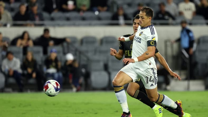 May 23, 2023; Los Angeles, CA, USA;  Los Angeles Galaxy forward Javier Hernandez (14) and Los Angeles FC defender Diego Rosales (43) battle for the ball during the first half at BMO Stadium. Mandatory Credit: Kiyoshi Mio-USA TODAY Sports