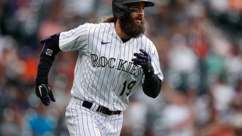 May 25, 2023; Denver, Colorado, USA; Colorado Rockies pinch hitter Charlie Blackmon (19) runs to first on a single in the eighth inning against the Miami Marlins at Coors Field. Mandatory Credit: Isaiah J. Downing-USA TODAY Sports