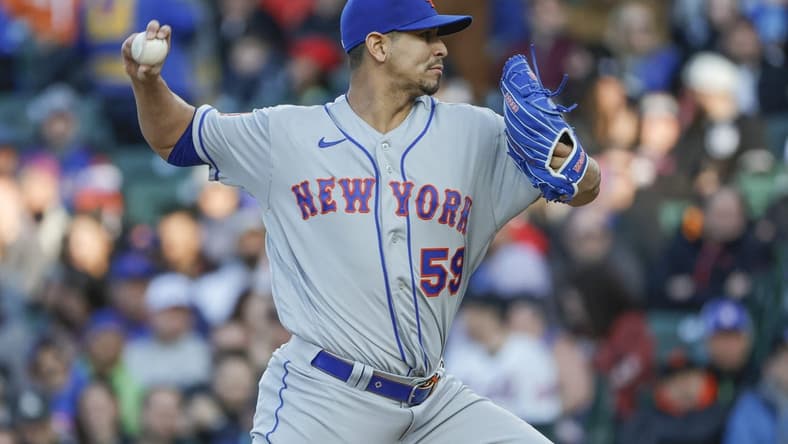 May 25, 2023; Chicago, Illinois, USA; New York Mets starting pitcher Carlos Carrasco (59) pitches against the Chicago Cubs during the first inning at Wrigley Field. Mandatory Credit: Kamil Krzaczynski-USA TODAY Sports