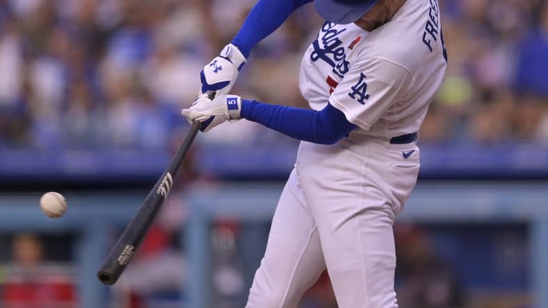 May 29, 2023; Los Angeles, California, USA; Los Angeles Dodgers first baseman Freddie Freeman (5) doubles in two runs in the fifth against the Washington Nationals at Dodger Stadium. Mandatory Credit: Jayne Kamin-Oncea-USA TODAY Sports