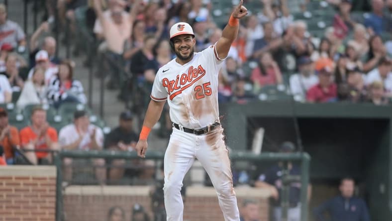 May 30, 2023; Baltimore, Maryland, USA; Baltimore Orioles right fielder Anthony Santander (25) reacts after scoring on left fielder Austin Hays (not pictured) sacrifice fly during the second inning against the Cleveland Guardians at Oriole Park at Camden Yards. Mandatory Credit: Tommy Gilligan-USA TODAY Sports