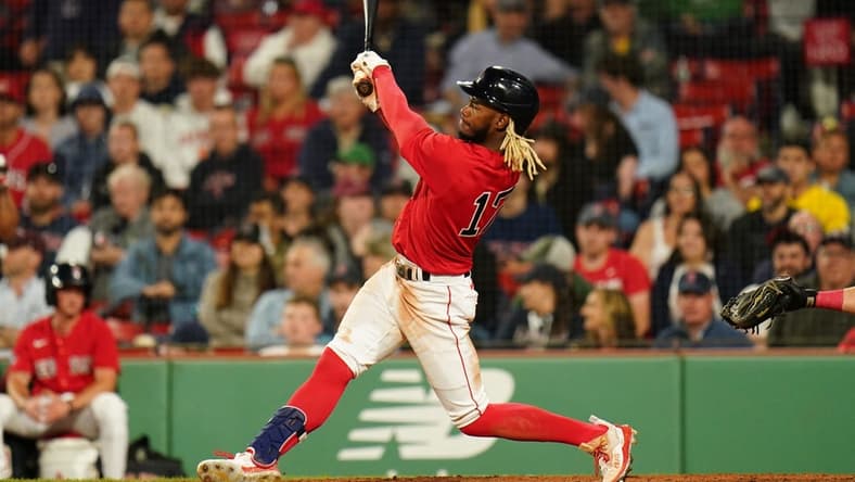 May 30, 2023; Boston, Massachusetts, USA; Boston Red Sox center fielder Raimel Tapia (17) gets a hit to drive in a. Run against the Cincinnati Reds in the ninth inning at Fenway Park. Mandatory Credit: David Butler II-USA TODAY Sports