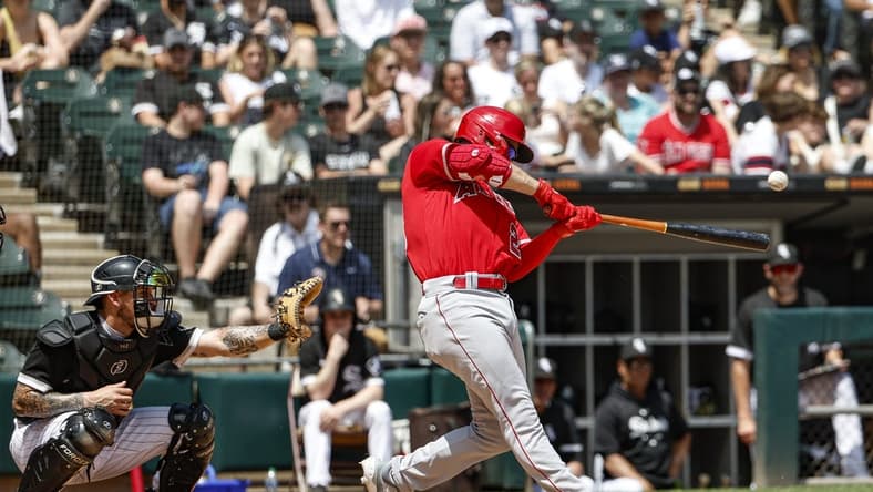 May 31, 2023; Chicago, Illinois, USA; Los Angeles Angels first baseman Jared Walsh (20) hits a two-run double against the Chicago White Sox during the third inning at Guaranteed Rate Field. Mandatory Credit: Kamil Krzaczynski-USA TODAY Sports