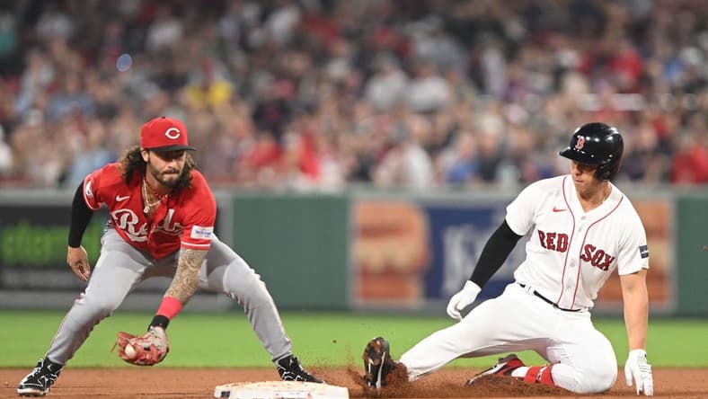 May 31, 2023; Boston, Massachusetts, USA; Boston Red Sox left fielder Rob Refsnyder (30) slides safely into second base ahead of a tag by Cincinnati Reds second baseman Jonathan India (6) during the sixth inning at Fenway Park. Mandatory Credit: Brian Fluharty-USA TODAY Sports