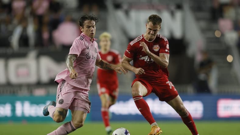 May 31, 2023; Fort Lauderdale, Florida, USA; Inter Miami midfielder Robert Taylor (16) battles for ball possession against New York Red Bulls forward Tom Barlow (74) during the second half at DRV PNK Stadium. Mandatory Credit: Sam Navarro-USA TODAY Sports