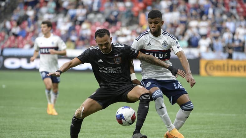 May 31, 2023; Vancouver, British Columbia, CAN; Houston Dynamo FC midfielder Artur (6) battles for the ball against Vancouver Whitecaps FC midfielder Pedro Vite (45) during the first half at BC Place. Mandatory Credit: Anne-Marie Sorvin-USA TODAY Sports