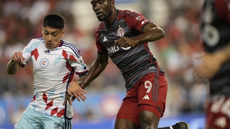 May 31, 2023; Toronto, Ontario, CAN; Toronto FC forward Charles Sapong (9) fights for the ball during the second half at BMO Field. Mandatory Credit: John E. Sokolowski-USA TODAY Sports